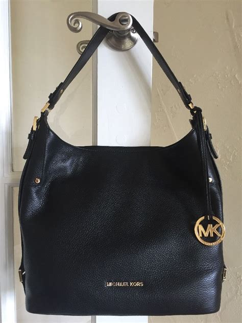 michael kors black handbag with gold hardware|vintage Michael Kors black handbags.